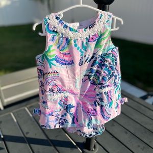 Infant dress in used condition. Size 12/18